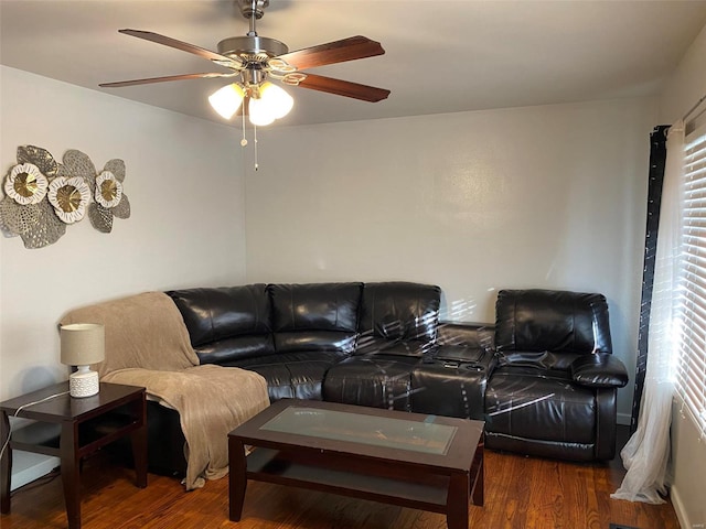 living room featuring dark hardwood / wood-style floors and ceiling fan