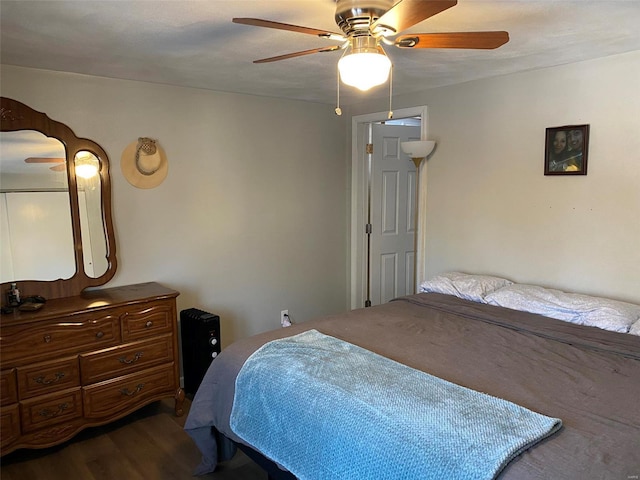 bedroom with hardwood / wood-style flooring and ceiling fan