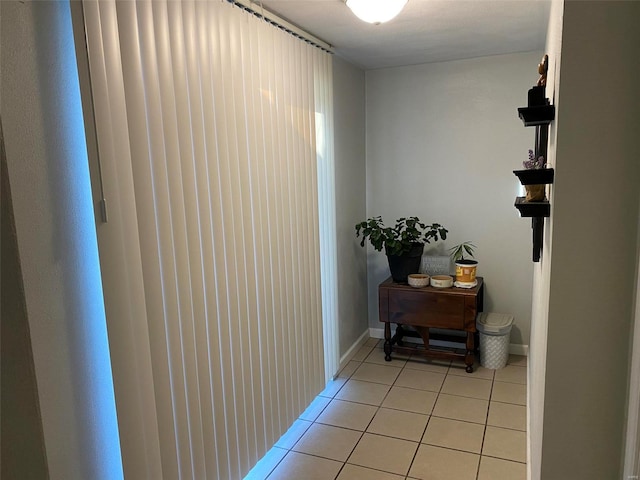 hallway featuring light tile patterned floors