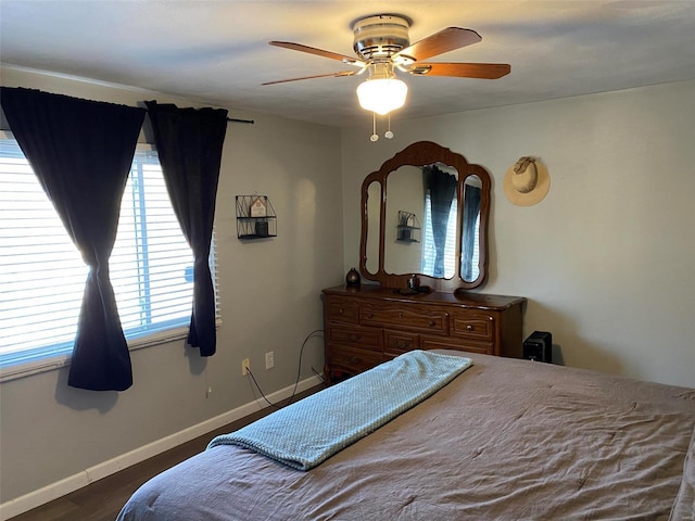 bedroom featuring dark wood-type flooring and ceiling fan