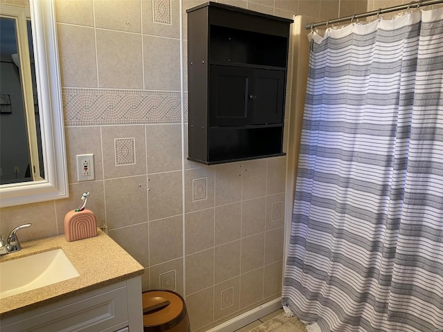 bathroom with tile walls and vanity