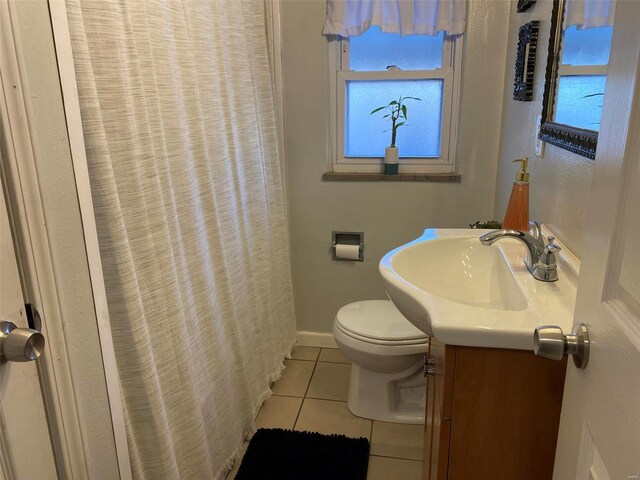 bathroom with tile patterned floors, toilet, and vanity