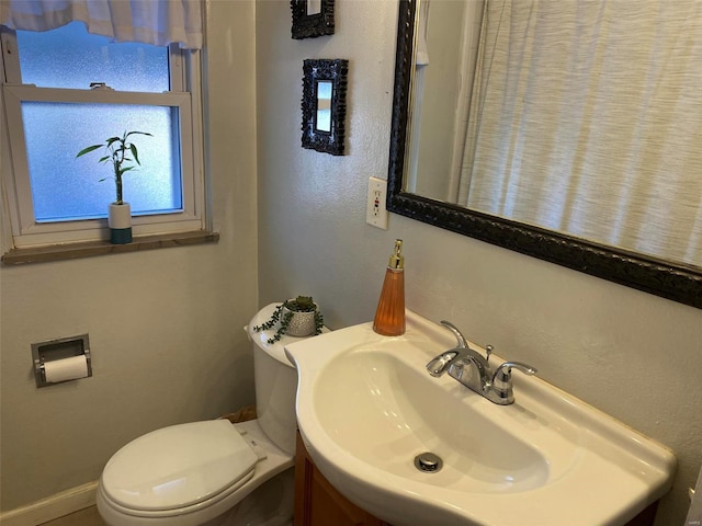 bathroom with sink and toilet