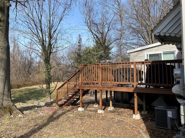 wooden deck featuring central air condition unit