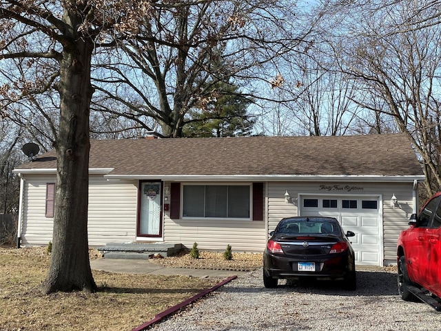 single story home with a garage