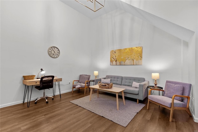 living room with hardwood / wood-style floors and high vaulted ceiling