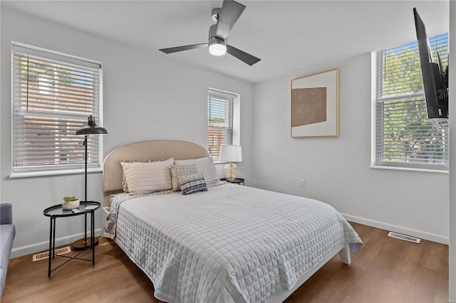 bedroom featuring hardwood / wood-style floors and ceiling fan