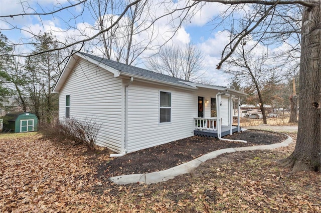 view of property exterior featuring a storage shed and an outdoor structure