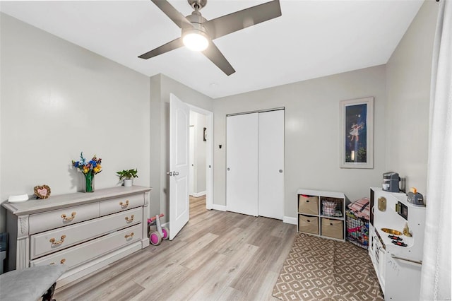 interior space with ceiling fan, light wood-type flooring, and baseboards