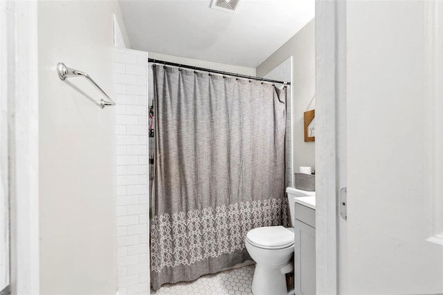 full bathroom featuring visible vents, toilet, a shower with curtain, tile patterned floors, and vanity