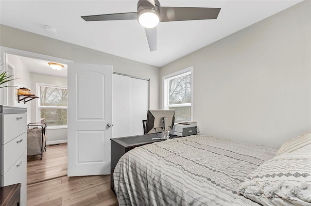 bedroom featuring a closet, ceiling fan, and wood finished floors