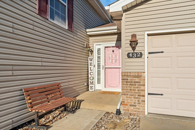 doorway to property featuring a garage