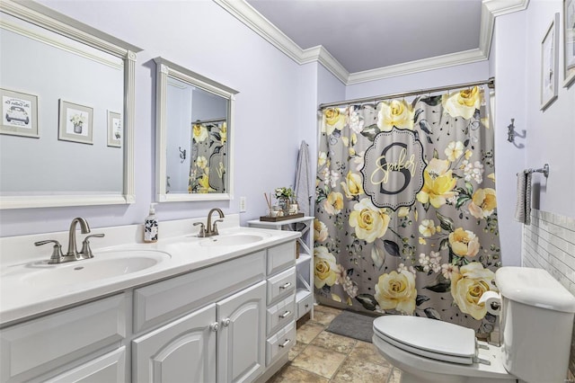 bathroom with vanity, curtained shower, ornamental molding, and toilet