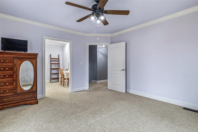 unfurnished bedroom featuring ornamental molding, light colored carpet, and ceiling fan