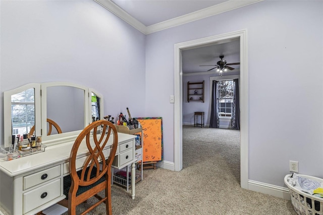 carpeted office space with ceiling fan and ornamental molding