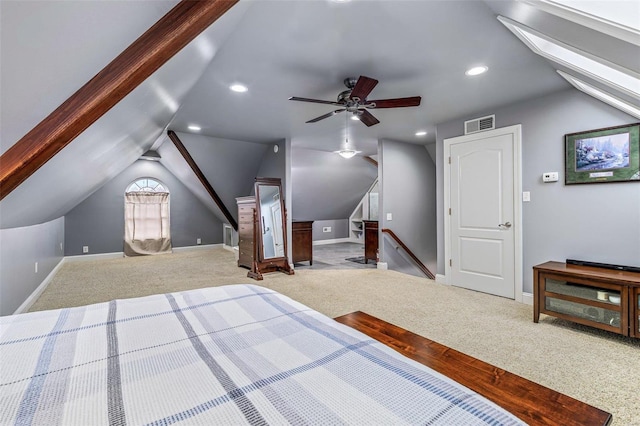 bedroom featuring vaulted ceiling with skylight and carpet floors