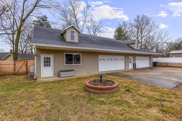 cape cod house with a garage and a front yard