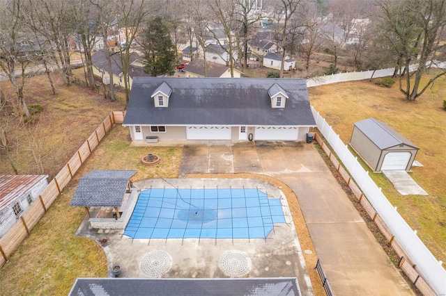 view of swimming pool with a yard, a fire pit, and a patio