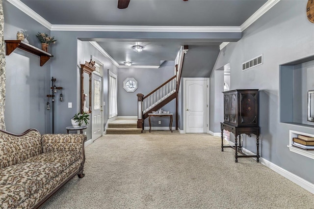 carpeted living room featuring ornamental molding