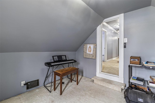 carpeted office space with lofted ceiling