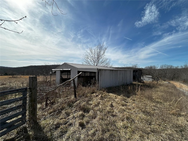 view of outbuilding featuring a rural view