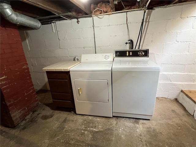 laundry room with independent washer and dryer