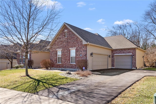 view of side of home featuring aphalt driveway, roof with shingles, brick siding, a yard, and a garage