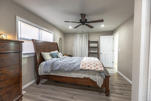 bedroom featuring hardwood / wood-style floors and ceiling fan