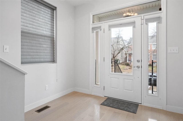 doorway to outside with light hardwood / wood-style floors