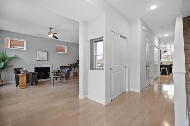 hall with light hardwood / wood-style floors