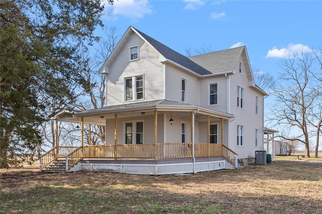 farmhouse inspired home featuring central AC and a porch