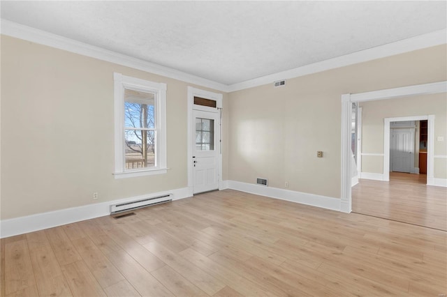 spare room with a baseboard heating unit, crown molding, a textured ceiling, and light wood-type flooring