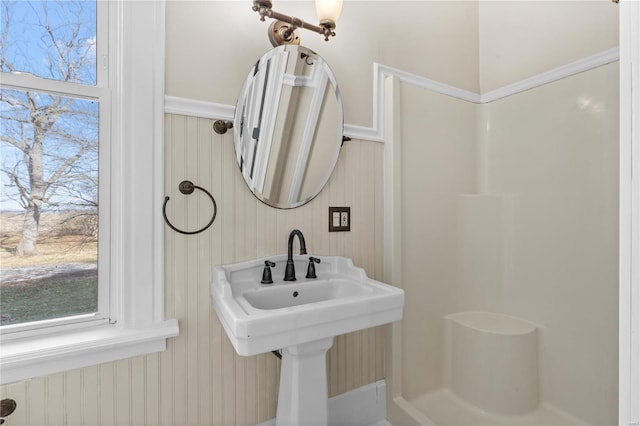 bathroom featuring plenty of natural light and walk in shower