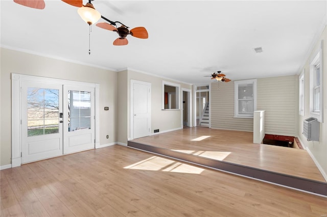 interior space with crown molding, ceiling fan, plenty of natural light, and light hardwood / wood-style flooring