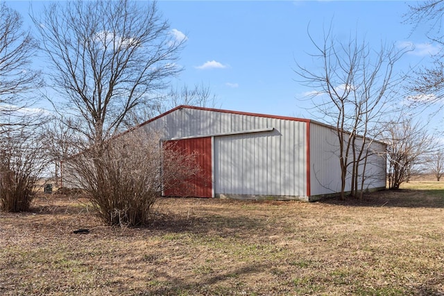 view of outdoor structure with a lawn