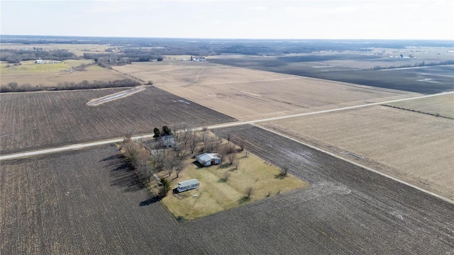 birds eye view of property with a rural view