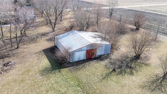 birds eye view of property with a rural view