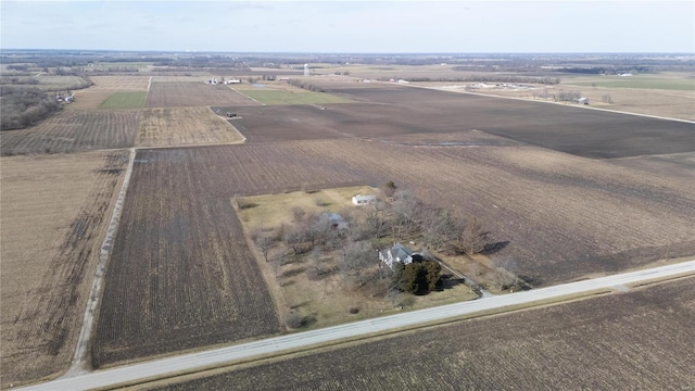 birds eye view of property with a rural view