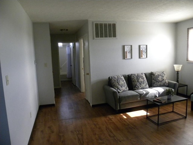 living room with dark wood-type flooring