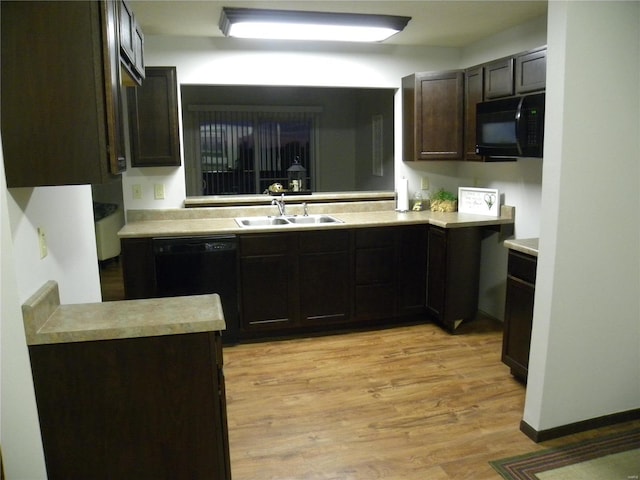 kitchen with dark brown cabinetry, sink, light hardwood / wood-style flooring, and black appliances