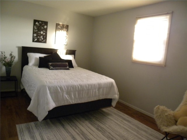 bedroom featuring dark hardwood / wood-style floors