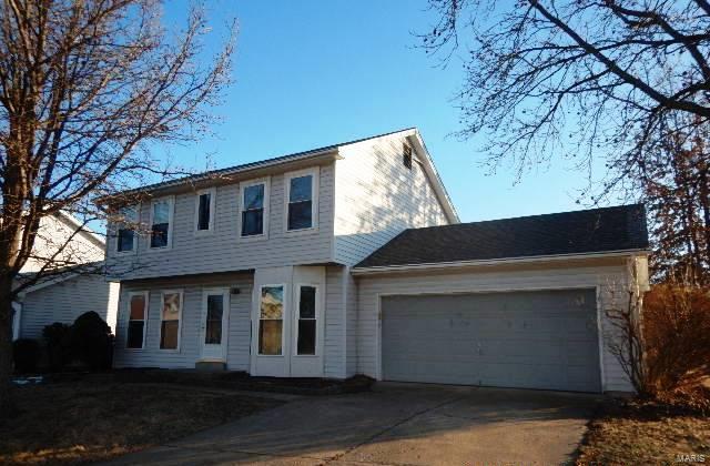 colonial-style house featuring a garage