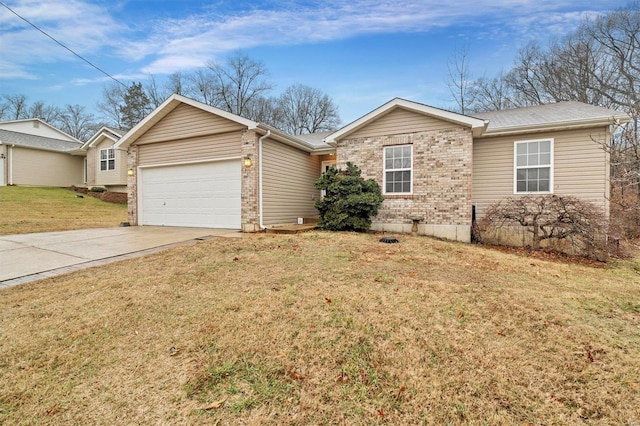 ranch-style home with a garage and a front lawn