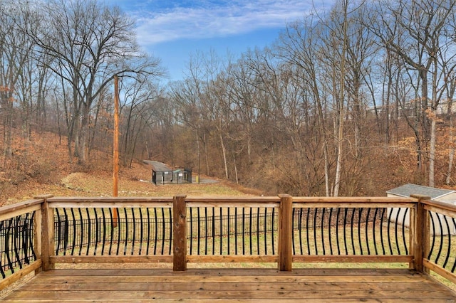 wooden deck featuring a yard