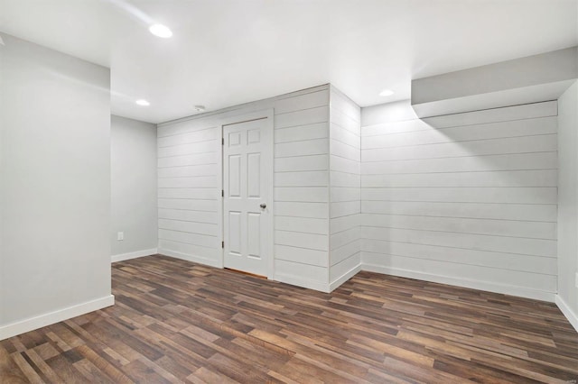 basement featuring dark hardwood / wood-style floors