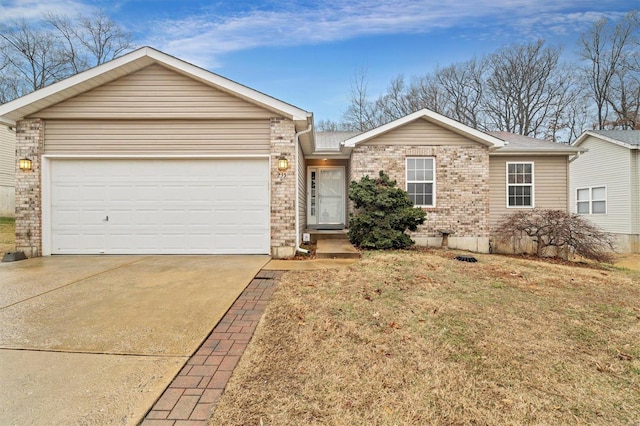 ranch-style house featuring a garage and a front yard