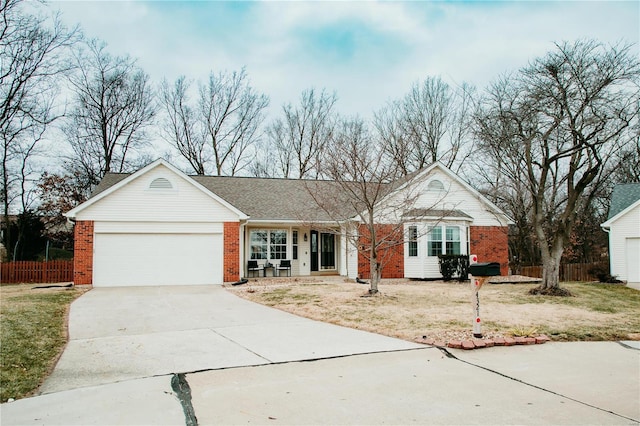 ranch-style house with a garage and a front yard