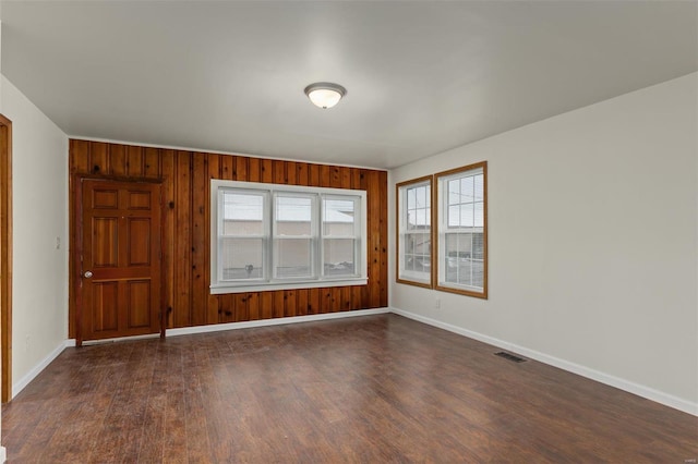 empty room featuring dark hardwood / wood-style floors