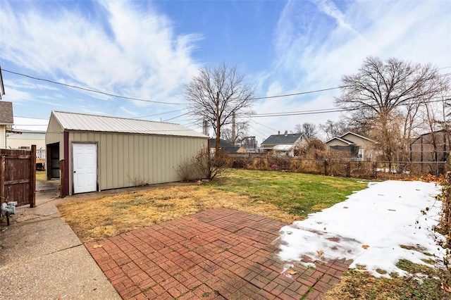 view of patio with an outbuilding