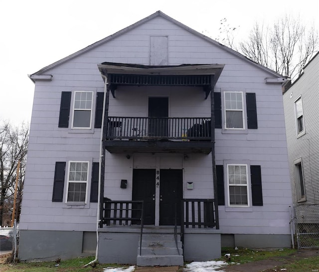 view of front of property with a balcony